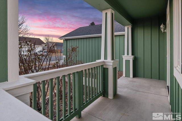 view of balcony at dusk