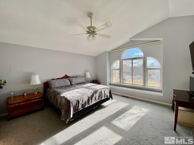 carpeted bedroom with ceiling fan and lofted ceiling