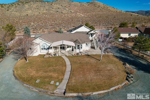 birds eye view of property with a mountain view