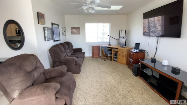 carpeted living room with ceiling fan