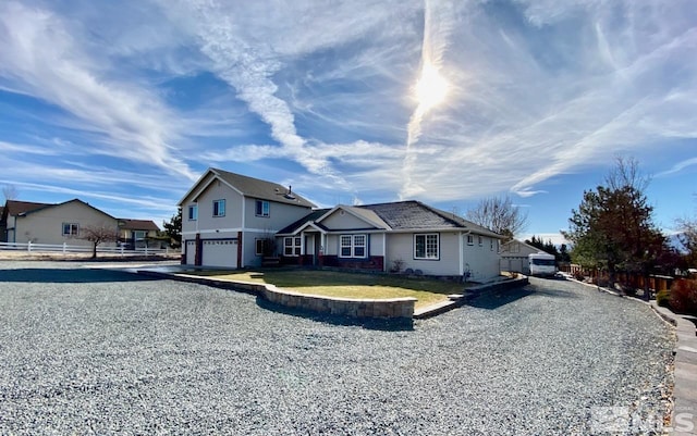 view of front of home with a front yard and a garage