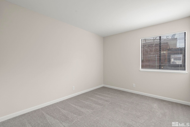 empty room featuring light carpet