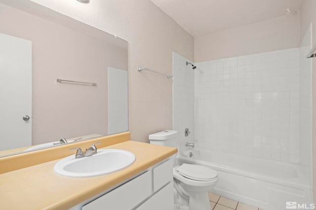 full bathroom with tile patterned floors, washtub / shower combination, vanity, and toilet