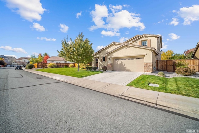 view of front of house featuring a front yard and a garage