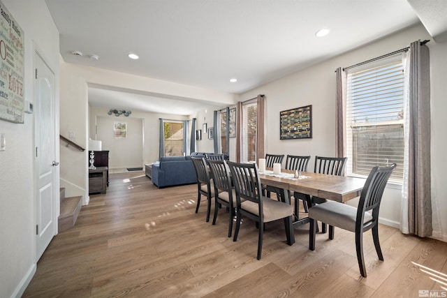 dining area with light hardwood / wood-style floors