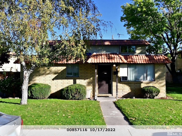 view of front of property with a front lawn