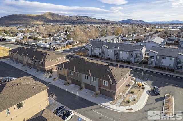 birds eye view of property with a mountain view