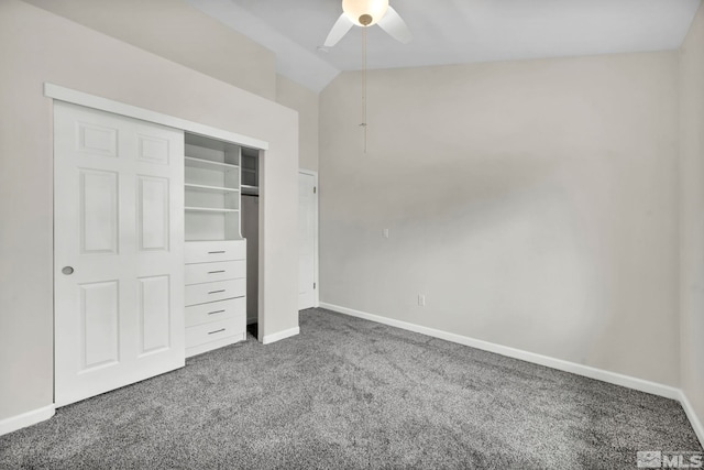 unfurnished bedroom with ceiling fan, lofted ceiling, carpet floors, and a closet