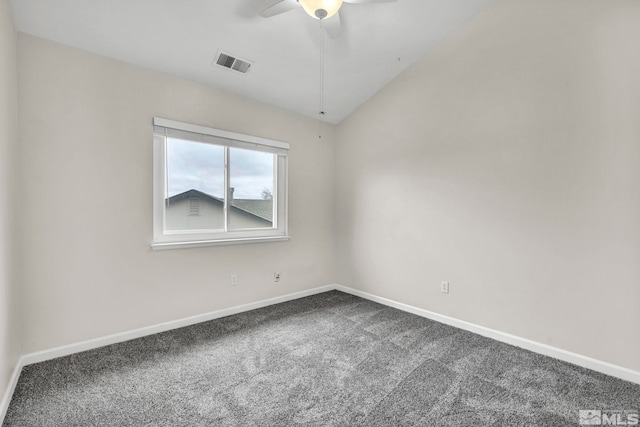 unfurnished room featuring carpet flooring, vaulted ceiling, and ceiling fan