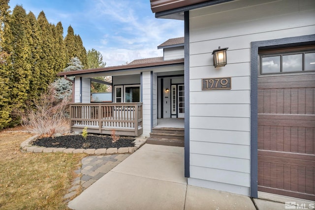 property entrance featuring covered porch