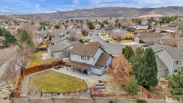 birds eye view of property featuring a mountain view