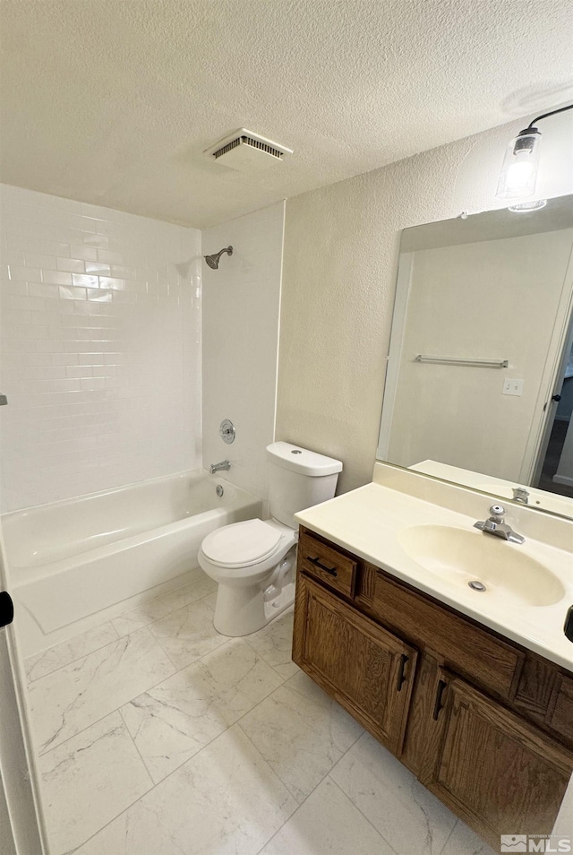 full bathroom with a textured ceiling, vanity, toilet, and shower / washtub combination