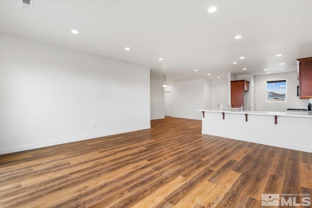 interior space with dark wood-type flooring and sink