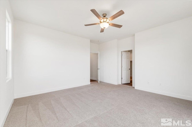 unfurnished room featuring ceiling fan and light colored carpet