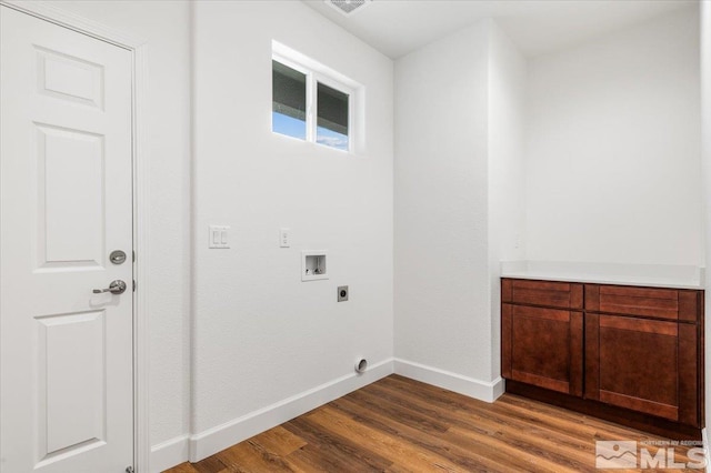 washroom featuring hardwood / wood-style flooring, electric dryer hookup, and hookup for a washing machine