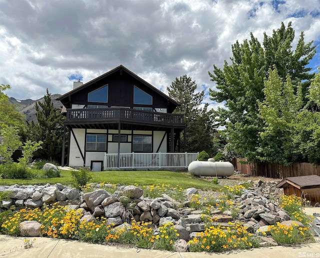 back of house featuring a wooden deck