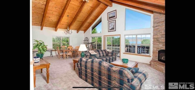 living room with carpet flooring, beam ceiling, a chandelier, and wooden ceiling