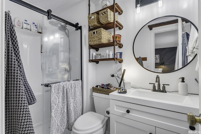 bathroom featuring vanity, toilet, and an enclosed shower