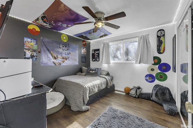 bedroom featuring ceiling fan and wood-type flooring