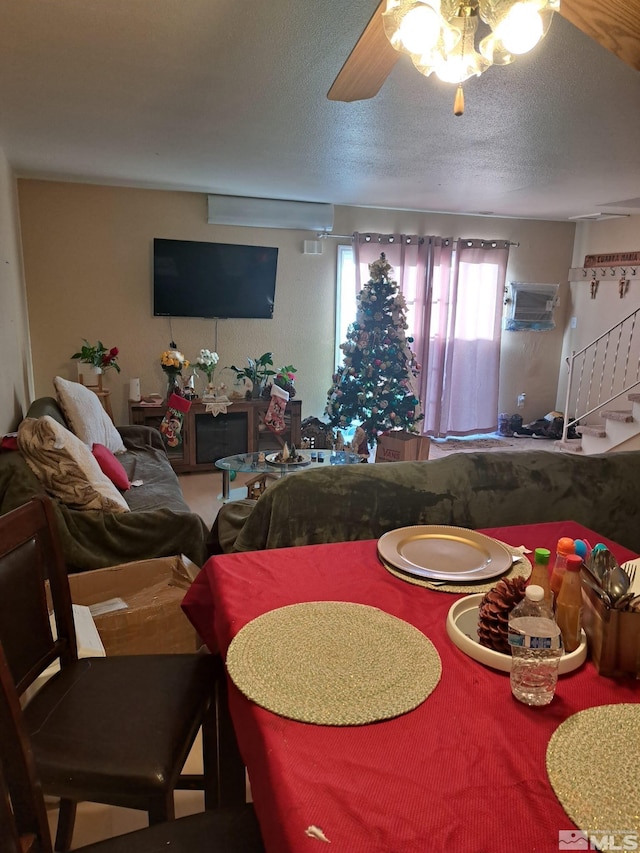 dining room with ceiling fan and a textured ceiling