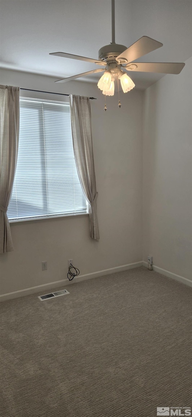 unfurnished room with carpet and ceiling fan