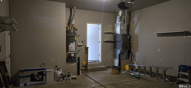 utility room featuring secured water heater