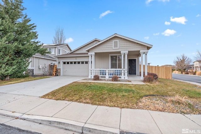 view of front facade featuring a front yard, a porch, and a garage