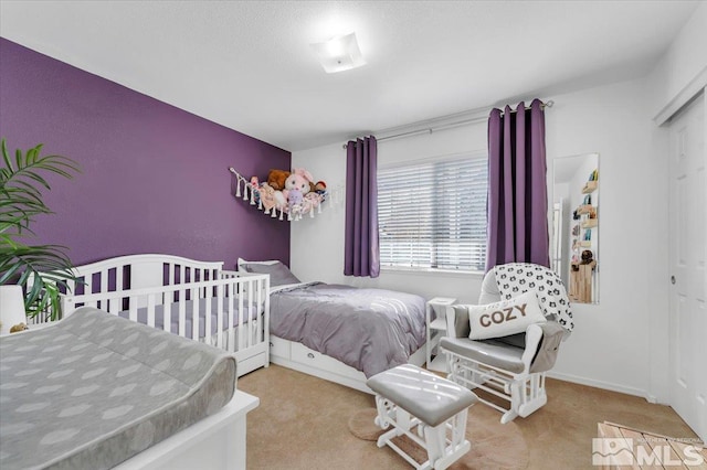 bedroom with a closet and carpet floors