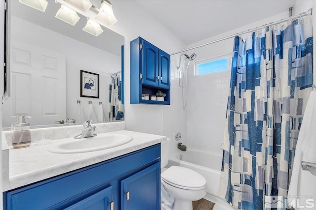 full bathroom with vanity, shower / bath combo, and toilet