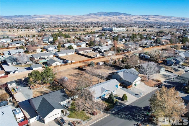 birds eye view of property featuring a mountain view