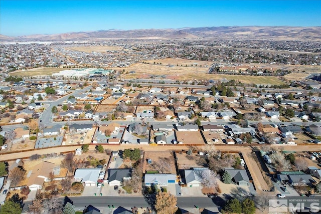 birds eye view of property with a mountain view