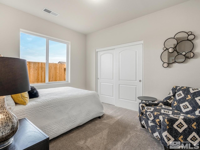 bedroom with carpet floors and a closet