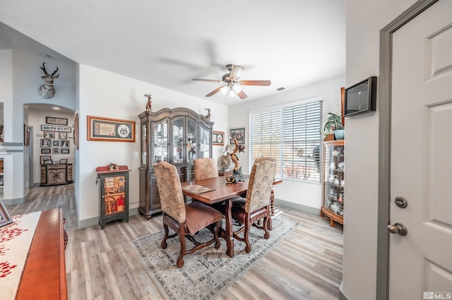 dining room featuring ceiling fan and light hardwood / wood-style flooring