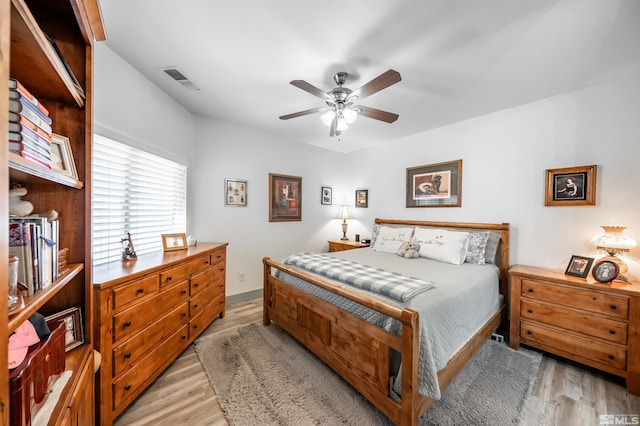 bedroom featuring ceiling fan and light hardwood / wood-style flooring