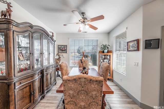 dining space featuring ceiling fan and light hardwood / wood-style floors