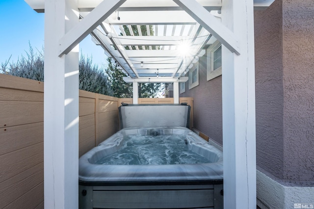 view of patio / terrace with a hot tub