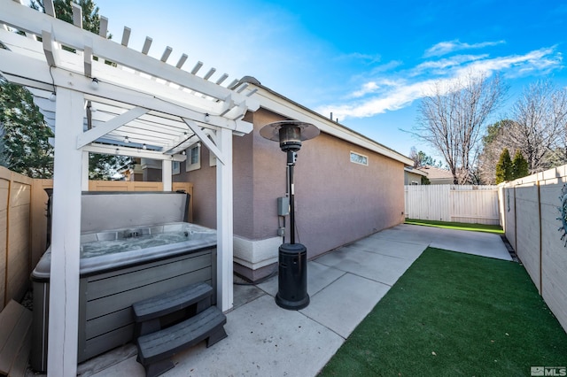 view of patio with a pergola and a hot tub