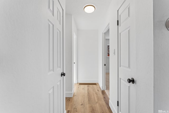 hallway featuring light wood-type flooring