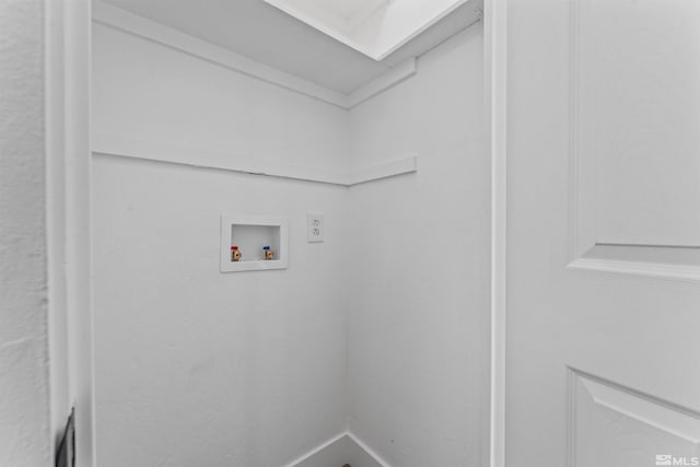 clothes washing area with a skylight and washer hookup