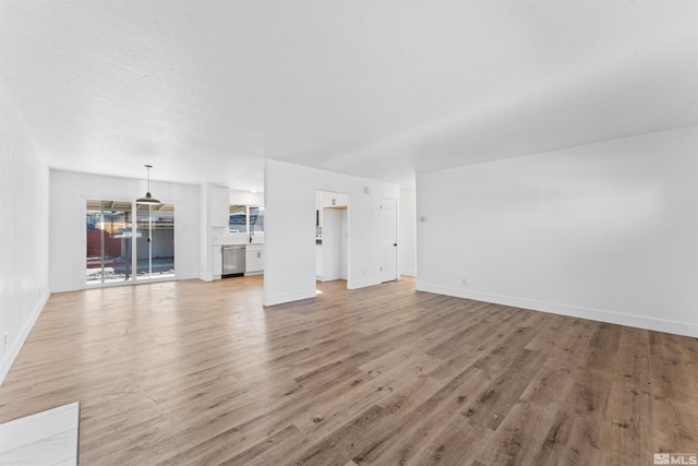 unfurnished living room featuring light hardwood / wood-style flooring