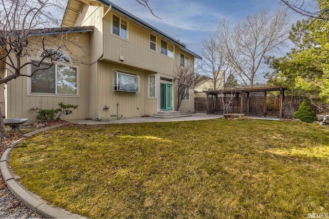 back of house with a patio area and a yard