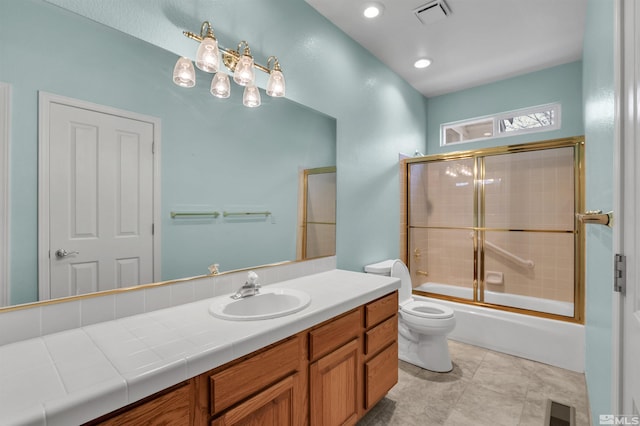 full bathroom featuring vanity, toilet, and enclosed tub / shower combo