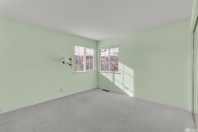 empty room with light colored carpet