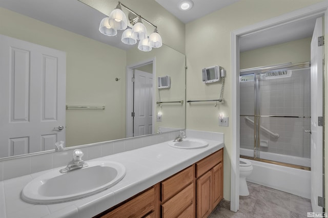 full bathroom featuring vanity, toilet, and enclosed tub / shower combo