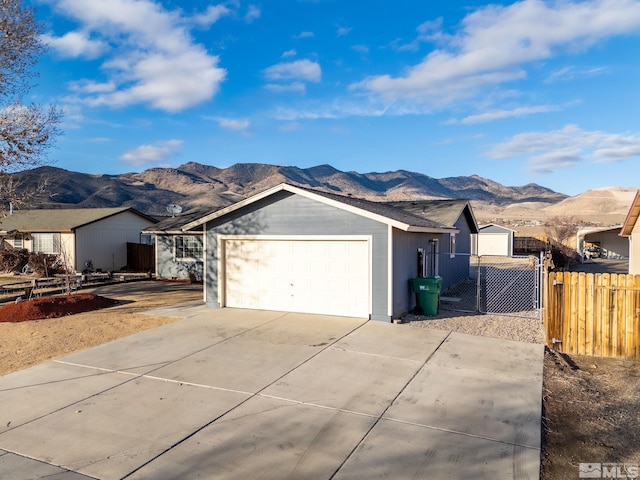 ranch-style home featuring a mountain view and a garage