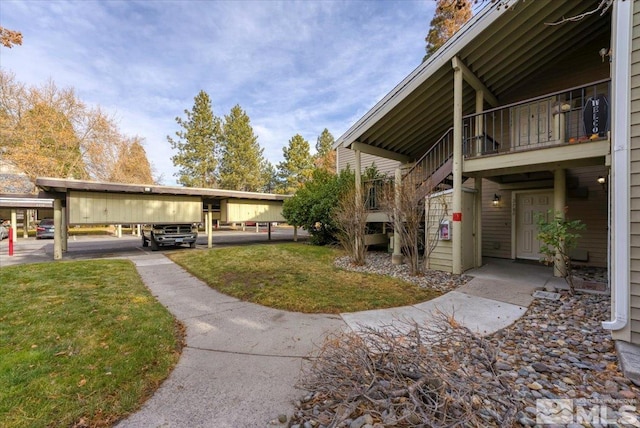 view of home's community featuring a yard