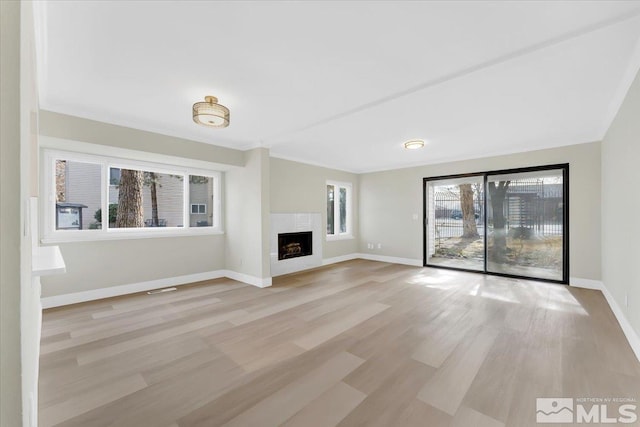 unfurnished living room with light hardwood / wood-style floors