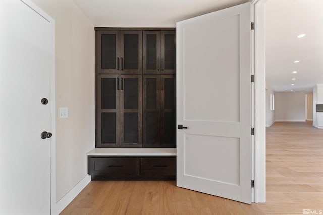 hall with light hardwood / wood-style floors