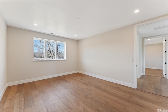 spare room with light wood-type flooring