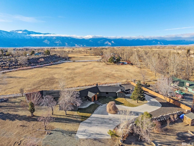 drone / aerial view with a mountain view and a rural view